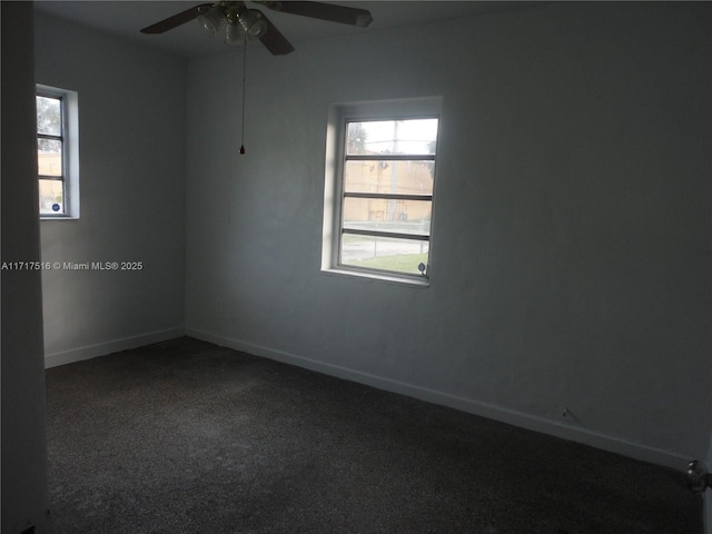 carpeted empty room featuring ceiling fan