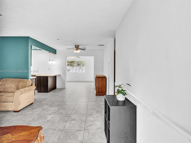 corridor featuring light tile patterned floors