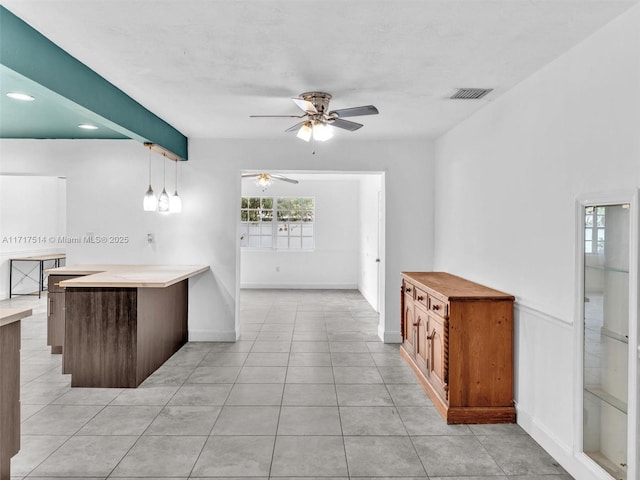 kitchen with kitchen peninsula and pendant lighting