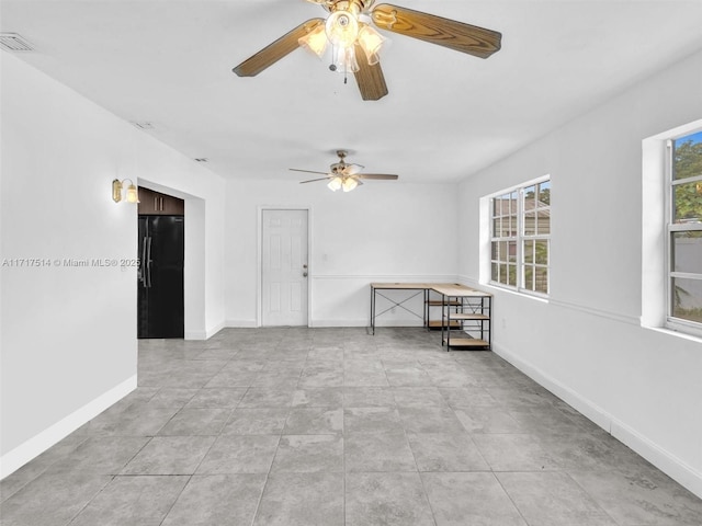 spare room featuring ceiling fan