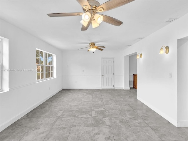 unfurnished room featuring ceiling fan