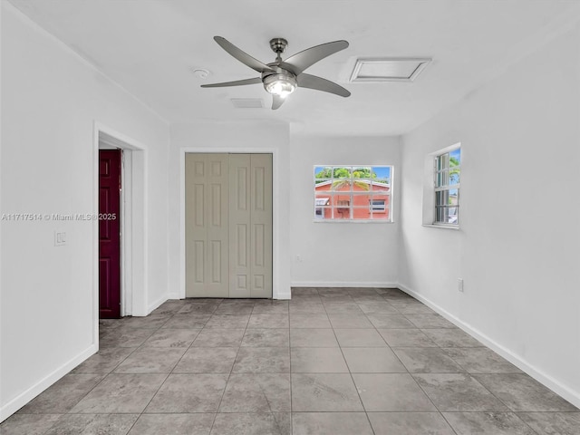 521 SW 68th Ter, Pembroke Pines, FL 33023 - tiled spare room with attic access, a ceiling fan, and baseboards