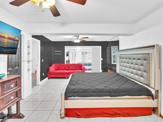 bedroom featuring ceiling fan and light tile patterned flooring