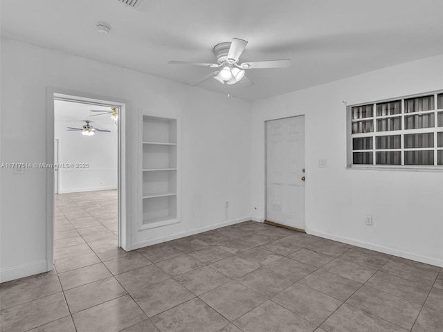 521 SW 68th Ter, Pembroke Pines, FL 33023 - empty room with built in shelves, ceiling fan, tile patterned flooring, and baseboards
