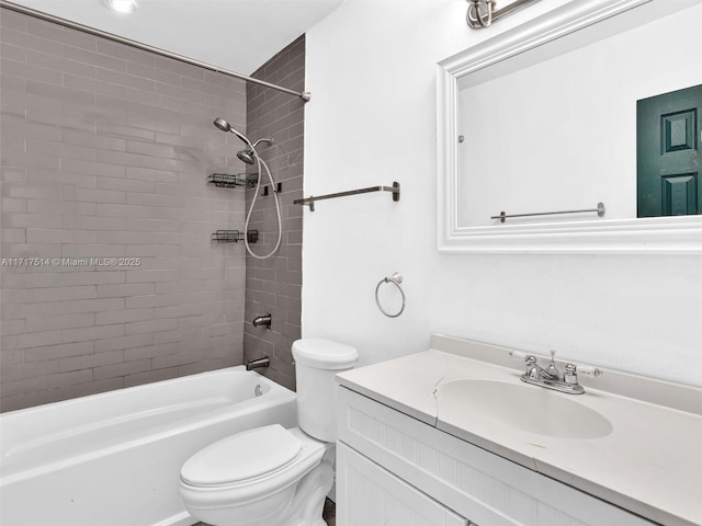 full bathroom with vanity, toilet, and tiled shower / bath