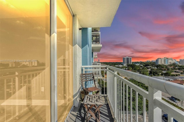 view of balcony at dusk