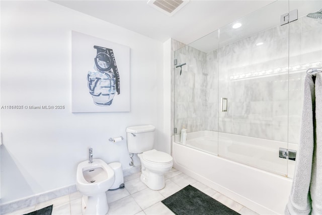 bathroom with toilet, tile patterned floors, a bidet, and bath / shower combo with glass door