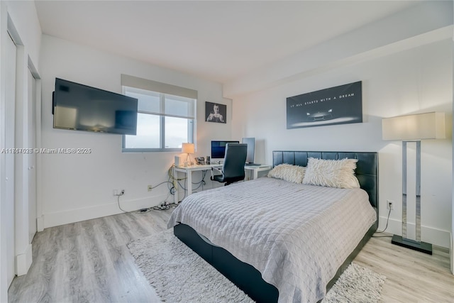 bedroom with light wood-type flooring