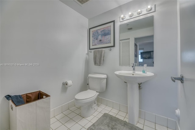 bathroom featuring tile patterned flooring and toilet