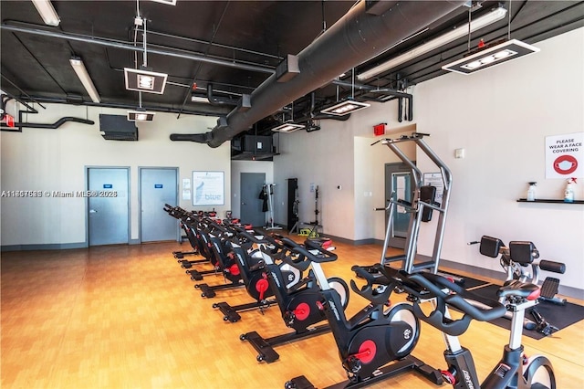 gym with wood-type flooring