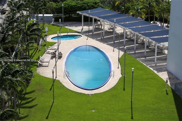 view of swimming pool featuring a patio area