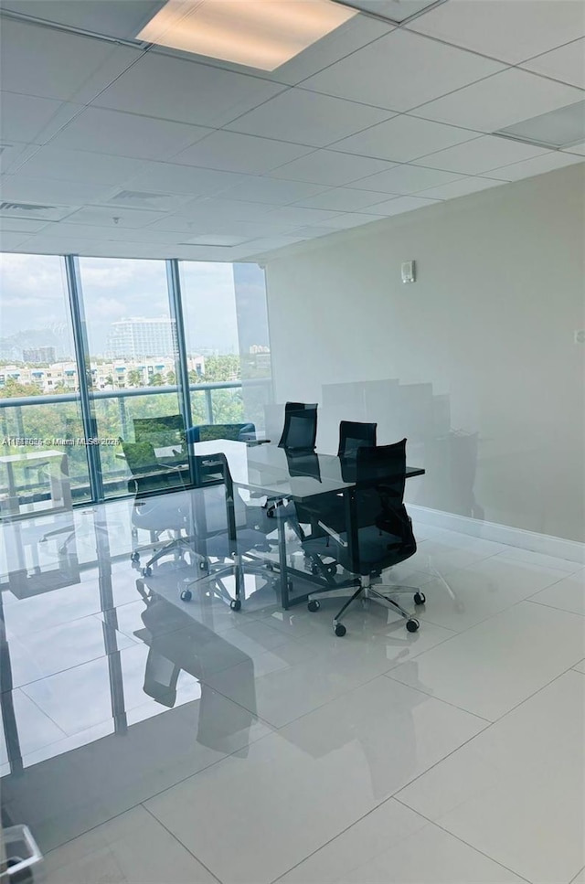 office with tile patterned flooring and floor to ceiling windows