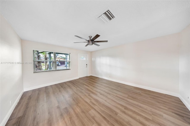 unfurnished room featuring ceiling fan and light hardwood / wood-style floors