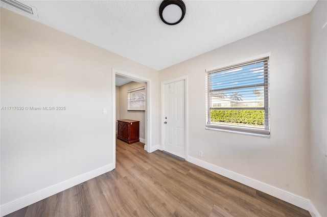 unfurnished room featuring light hardwood / wood-style flooring