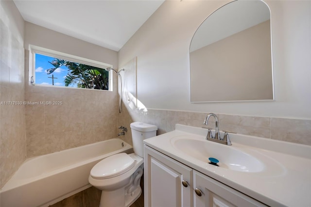 full bathroom with toilet, vanity, and tub / shower combination