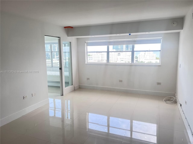 empty room featuring light tile patterned floors