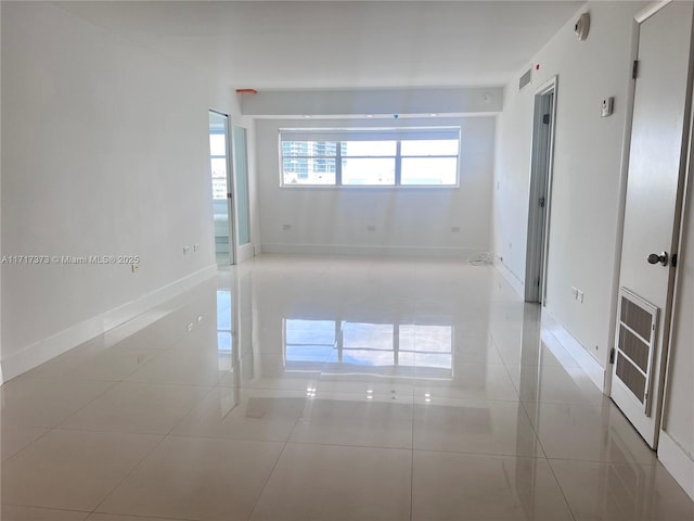 1881 Washington Ave Unit 11D, Miami Beach, FL 33139 - empty room featuring baseboards and light tile patterned floors