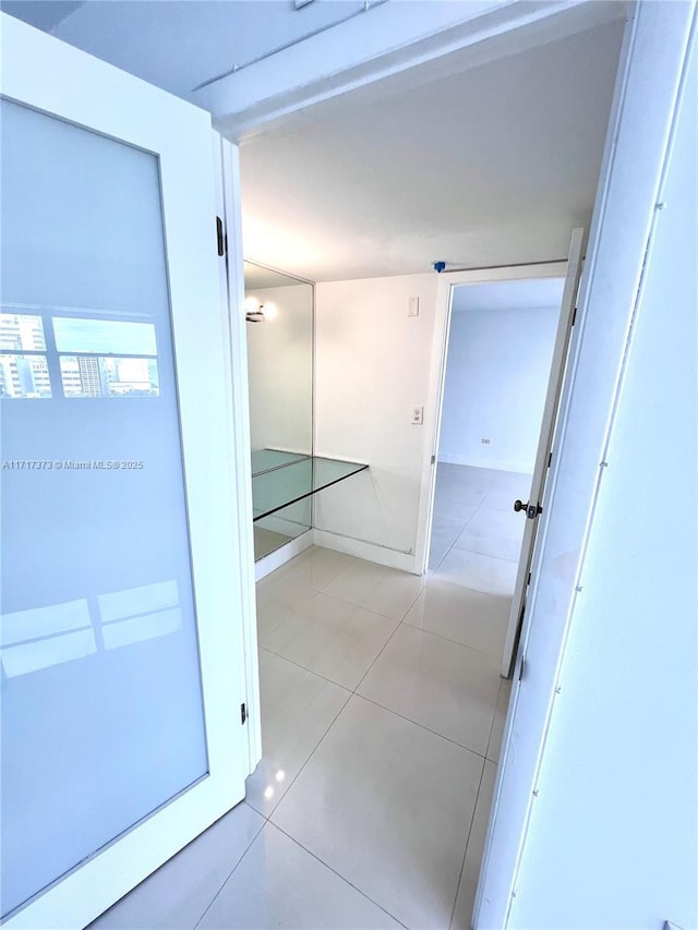 1881 Washington Ave Unit 11D, Miami Beach, FL 33139 - hallway with light tile patterned floors