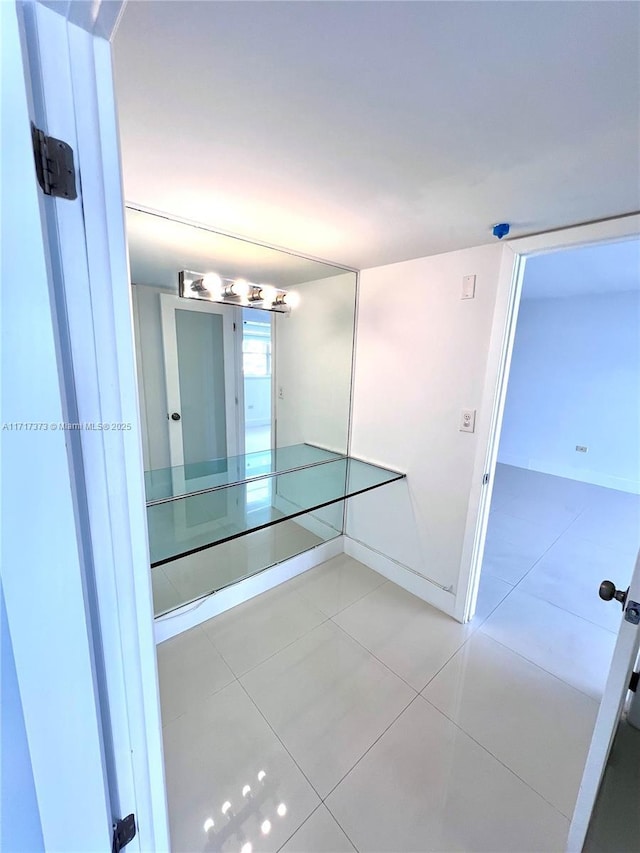 1881 Washington Ave Unit 11D, Miami Beach, FL 33139 - bathroom featuring tile patterned flooring and baseboards