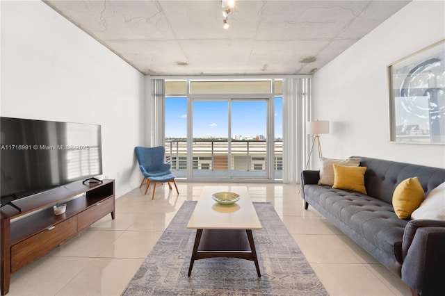 tiled living room featuring expansive windows