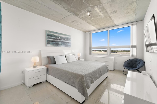 bedroom featuring light tile patterned floors