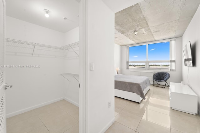 bedroom with light tile patterned flooring
