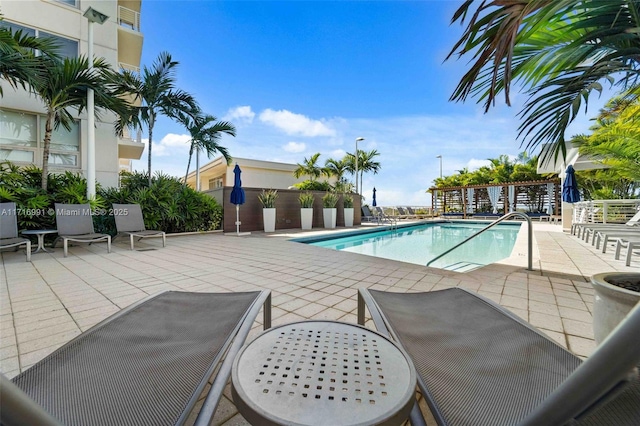 view of swimming pool featuring a patio area