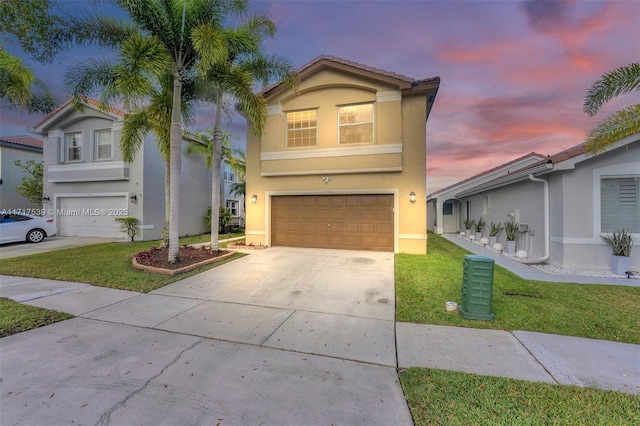 view of front of house with a lawn and a garage