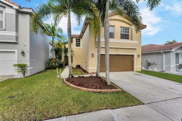 view of front of property featuring a front yard and a garage