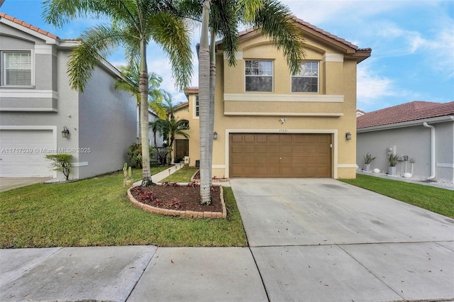 view of front of house featuring a garage and a front yard