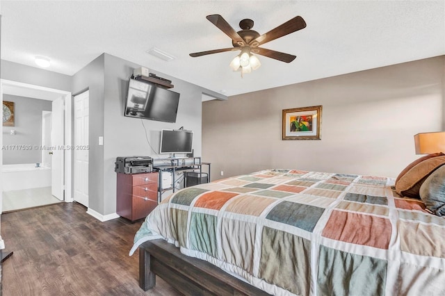 bedroom featuring ceiling fan, dark hardwood / wood-style flooring, a textured ceiling, and ensuite bath