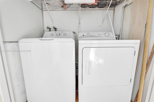 clothes washing area with independent washer and dryer