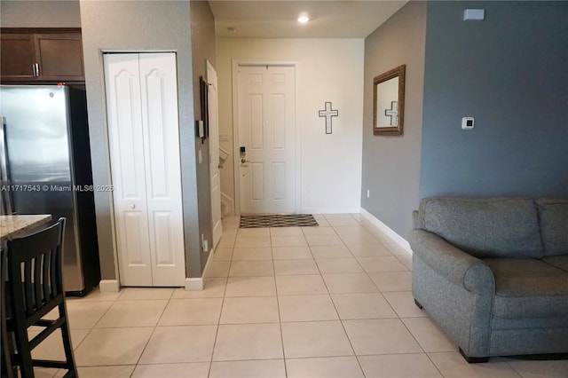 entrance foyer with light tile patterned flooring