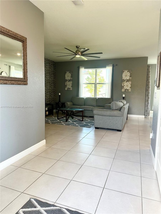 living room with light tile patterned floors and ceiling fan