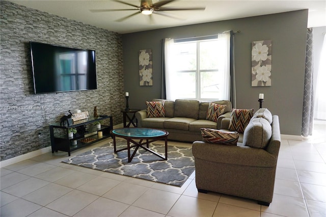 living room featuring light tile patterned floors and ceiling fan