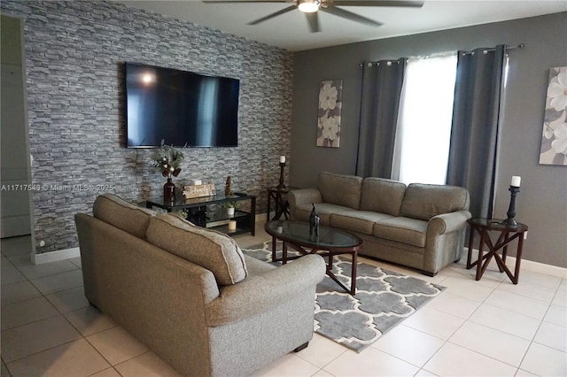 living room featuring ceiling fan and light tile patterned floors