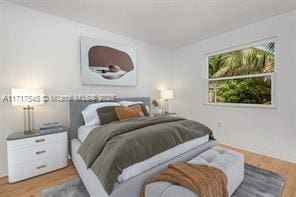 bedroom with wood-type flooring