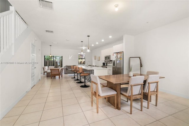 dining space featuring recessed lighting, visible vents, and light tile patterned floors