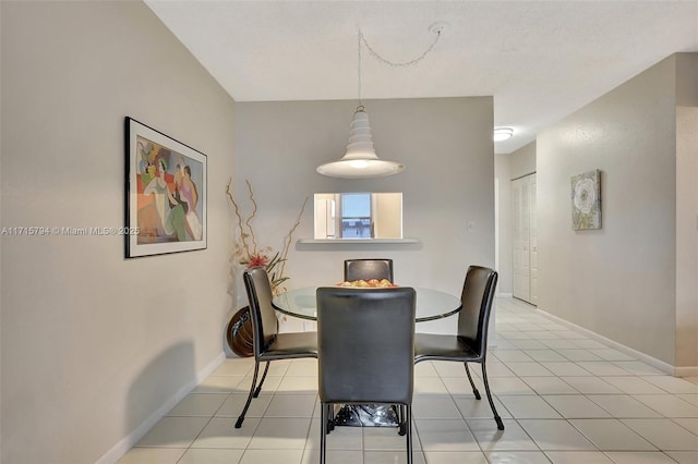 dining room featuring light tile patterned floors