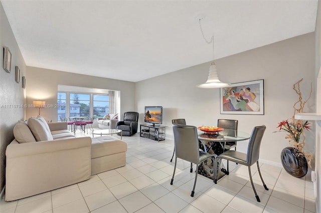 dining space featuring light tile patterned floors