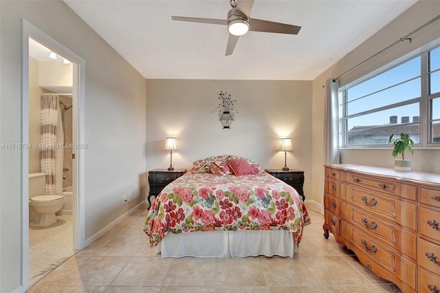 bedroom featuring light tile patterned floors, ensuite bath, and ceiling fan