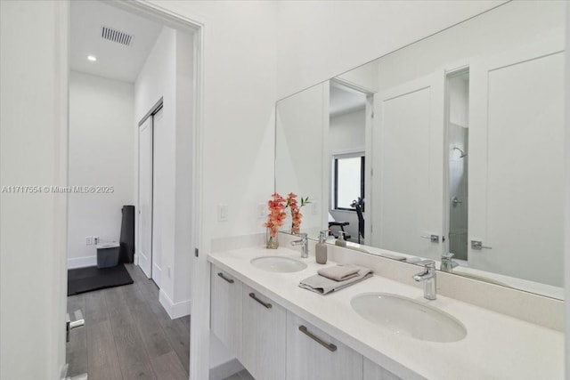 bathroom featuring vanity and wood-type flooring