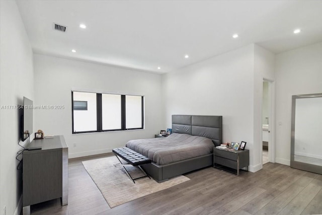 bedroom with light hardwood / wood-style flooring