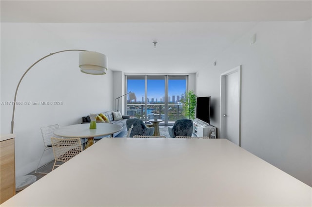 dining area featuring floor to ceiling windows