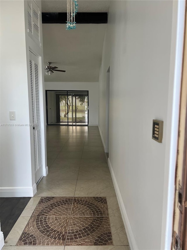 hallway with tile patterned flooring