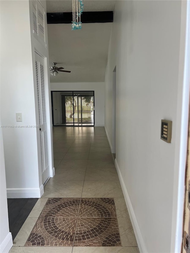 hall with tile patterned flooring