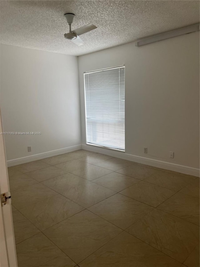 unfurnished room with a textured ceiling and ceiling fan