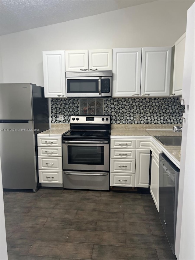 kitchen featuring white cabinets and stainless steel appliances