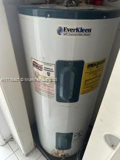 utility room with water heater