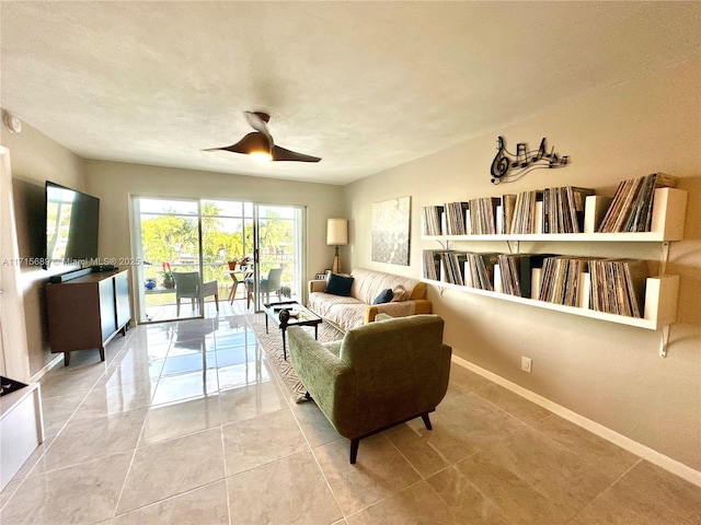 living room featuring ceiling fan